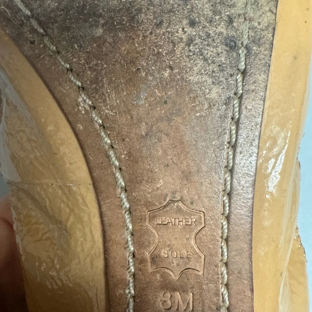 Tory Burch Black and Tan Leather Flats with Logo Medallion